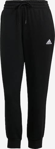 ADIDAS SPORTSWEAR - Tapered Calças de desporto 'Essentials' em preto: frente