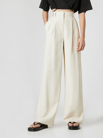 Guido Maria Kretschmer Collection Wide leg Pleat-Front Pants 'Avena' in Beige: front