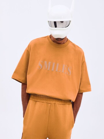 Smiles T-shirt 'Kalle' i orange: framsida