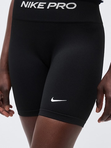 Skinny Pantaloni sport 'Seamless' de la NIKE pe negru