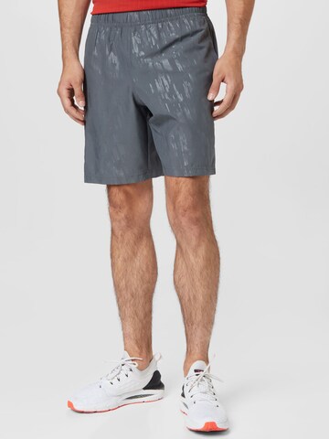 Regular Pantalon de sport 'Emboss' UNDER ARMOUR en gris : devant