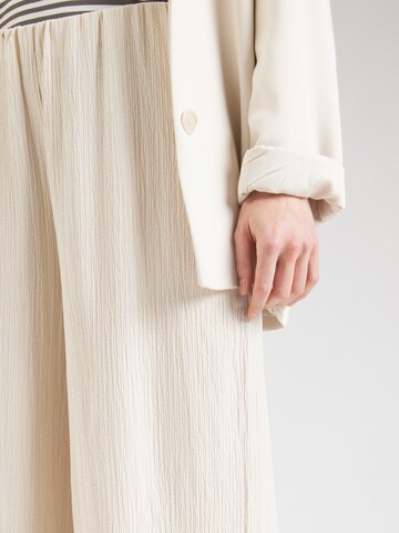 ABOUT YOU Loose fit Trousers 'Selma' in Beige