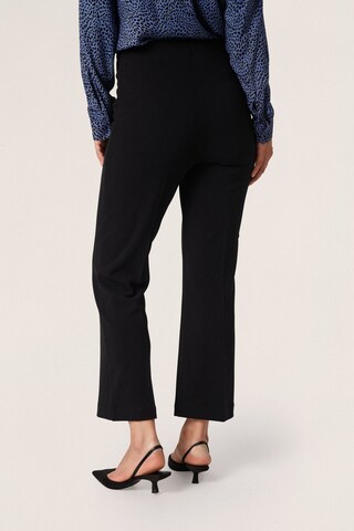 SOAKED IN LUXURY Boot cut Trousers with creases 'Bea ' in Black