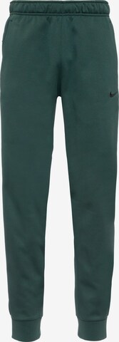 NIKE Tapered Athletic Pants in Green: front