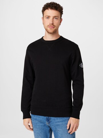 Sweat-shirt Calvin Klein Jeans en noir : devant