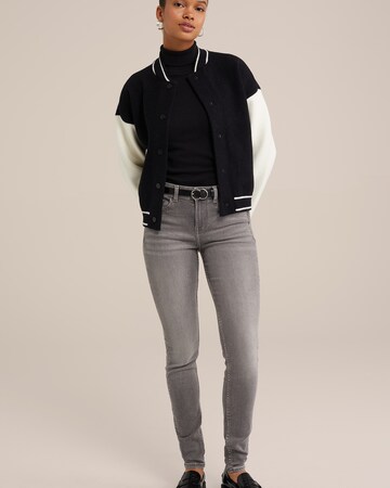 Skinny Jeans di WE Fashion in grigio