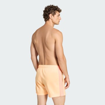 ADIDAS SPORTSWEAR Board shorts in Orange