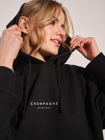 I want the moon Sweater 'Champagne Problems' in Black