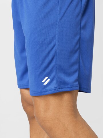 Superdry Štandardný strih Športové nohavice 'Core' - Modrá