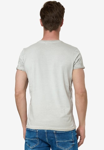 Rusty Neal Cooles T-Shirt mit Knopfleiste in Beige