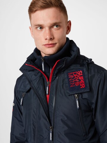 mėlyna Superdry Žieminė striukė 'Mountain'