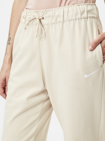 Nike Sportswear Zwężany krój Spodnie 'Easy' w kolorze beżowy