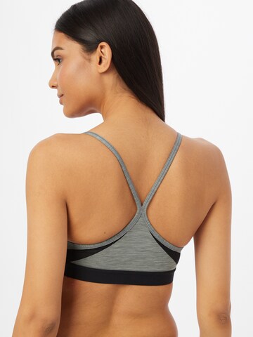 Bustino Reggiseno sportivo 'Indy' di NIKE in grigio