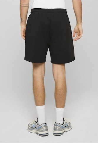 regular Pantaloni di Unfair Athletics in nero