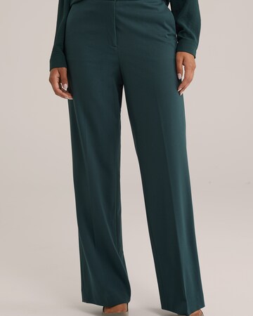 WE Fashion Loose fit Trousers with creases in Green: front