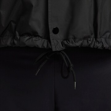 Nike Sportswear Between-season jacket 'Club Coaches' in Black
