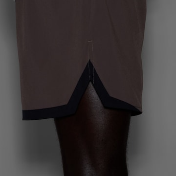 new balance Loosefit Sportbroek 'Essential' in Bruin