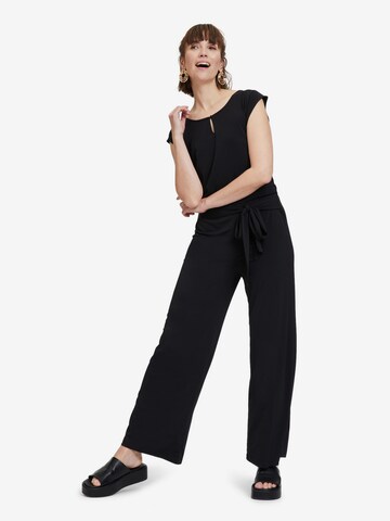 Cartoon Jumpsuit in Black: front