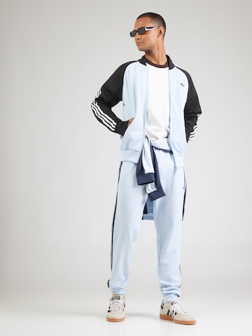 ADIDAS ORIGINALSTapered Hlače 'SST' - plava boja