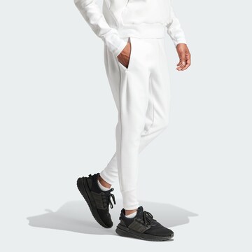 ADIDAS SPORTSWEAR Tapered Sports trousers 'Z.N.E. Premium' in White