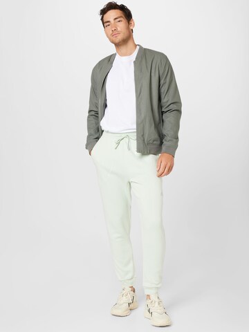 ADIDAS SPORTSWEAR Tapered Sportbroek 'Studio Lounge Fleece' in Groen