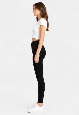 Skinny Jeans di Elara in nero