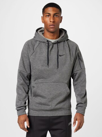 NIKE - Sweatshirt de desporto em cinzento: frente