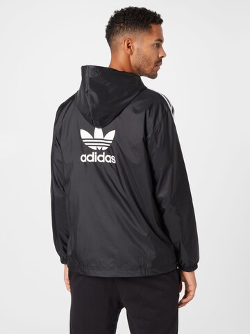 ADIDAS ORIGINALS Přechodná bunda – černá