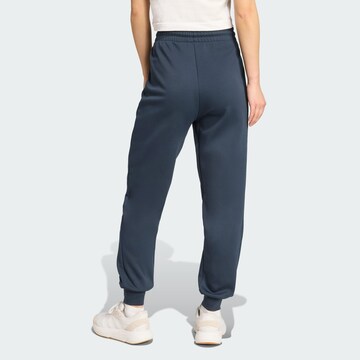 ADIDAS SPORTSWEAR - Tapered Calças de desporto 'Z.N.E.' em azul