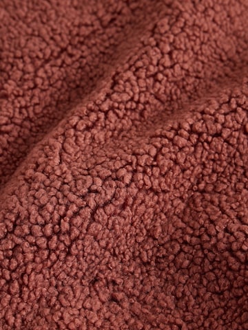 Pull-over self. en marron