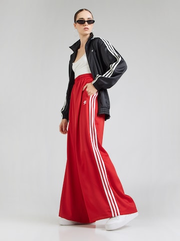 ADIDAS ORIGINALS - Pierna ancha Pantalón 'Adicolor' en rojo