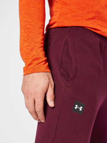 UNDER ARMOUR Tapered Urheiluhousut 'Rival' värissä punainen