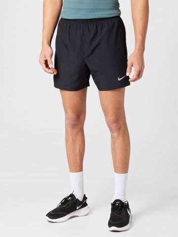 NIKE Regular Workout Pants in Black: front