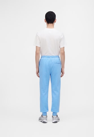 Nike Sportswear - Tapered Pantalón 'CLUB' en azul