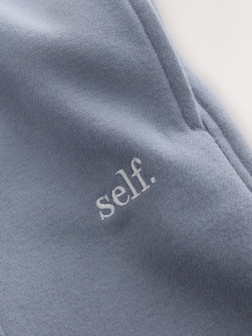 Wide leg Pantaloni sportivi di self. in blu