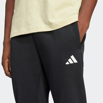 ADIDAS SPORTSWEAR Tapered Παντελόνι φόρμας 'Future Icons' σε μαύρο