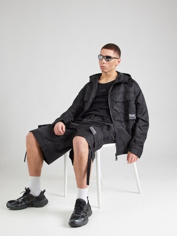 Veste mi-saison Versace Jeans Couture en noir : devant