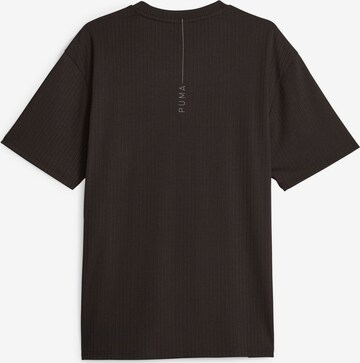 PUMA Λειτουργικό μπλουζάκι 'RECHARGE' σε μαύρο