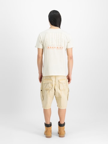 ALPHA INDUSTRIES Свободный крой Брюки-карго в Желтый