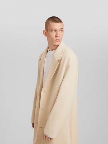 Bershka Between-Seasons Coat in Beige: front