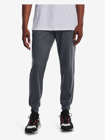 UNDER ARMOUR Tapered Sportbroek in Grijs: voorkant