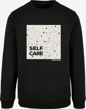 Sweat-shirt 'SELF CARE' F4NT4STIC en noir : devant