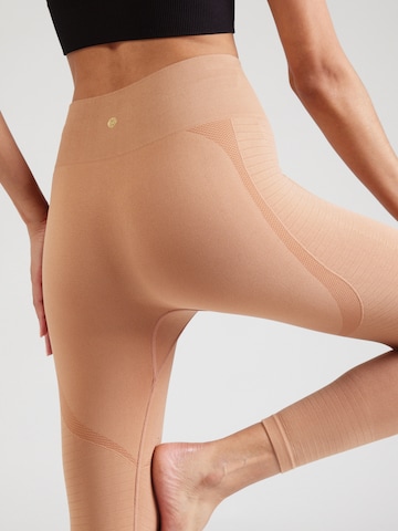 Athlecia Skinny Sportbroek 'Nagar' in Bruin