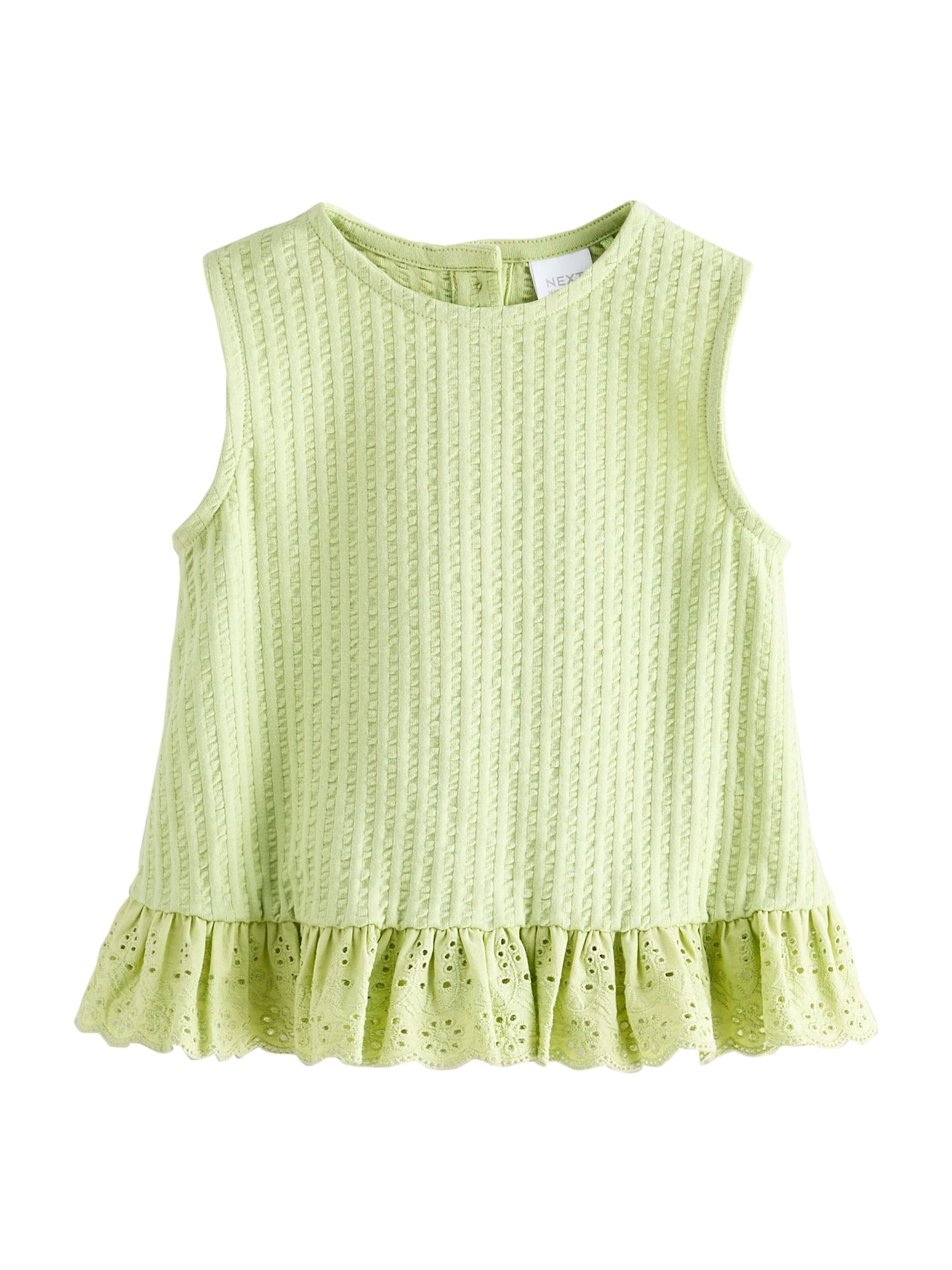 Top di Next in verde: frontale