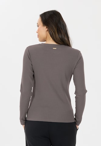 Athlecia Functioneel shirt 'Lankae' in Bruin
