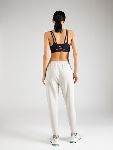 Athlecia Tapered Sports trousers 'Jacey V2' in White