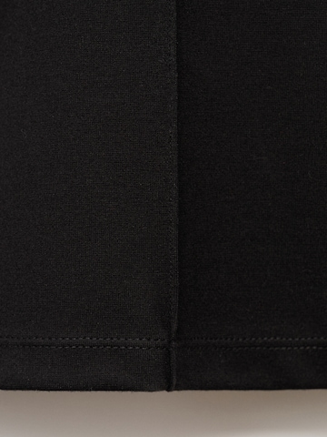 Evazați Pantaloni 'DELFI' de la MANGO pe negru