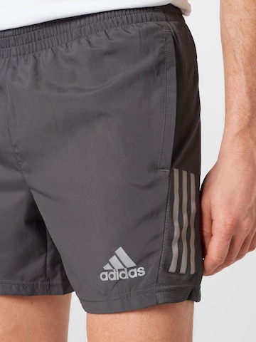 regular Pantaloni sportivi 'Own the Run' di ADIDAS SPORTSWEAR in grigio