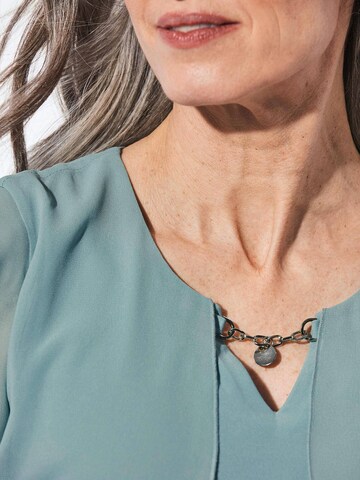 Goldner Kokerjurk in Groen