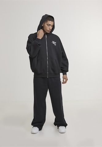 Karl Kani - Sudadera con cremallera 'Varsity' en negro